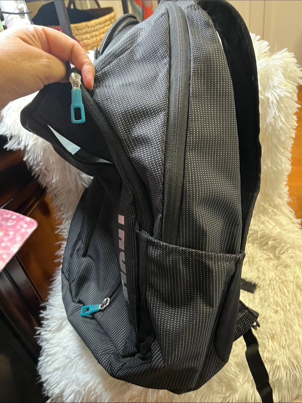 Thule Black Backpack with Teal Zipper Accents